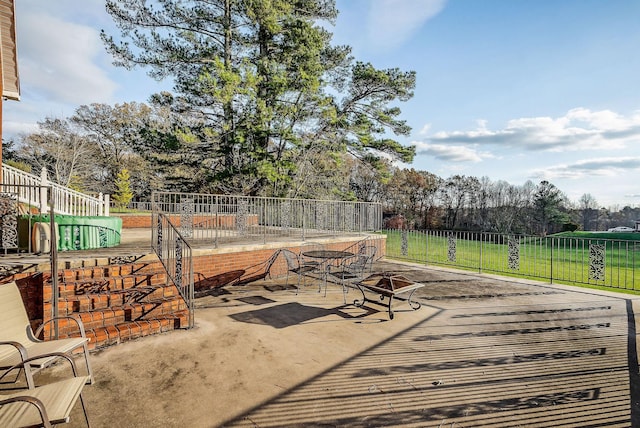 view of patio / terrace featuring an outdoor fire pit