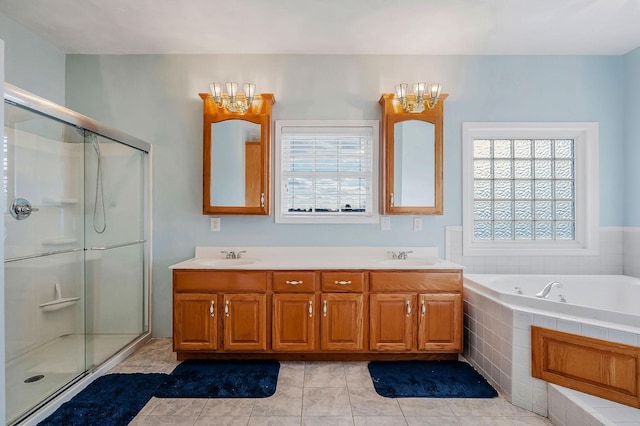 bathroom with tile patterned floors, plenty of natural light, and independent shower and bath