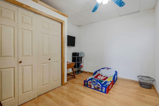 game room with hardwood / wood-style floors and ceiling fan