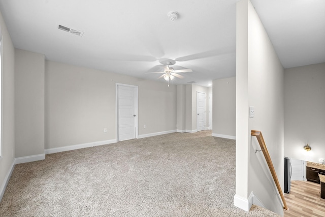 carpeted empty room with ceiling fan