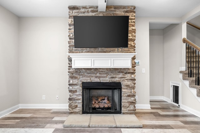 details with a fireplace and hardwood / wood-style floors