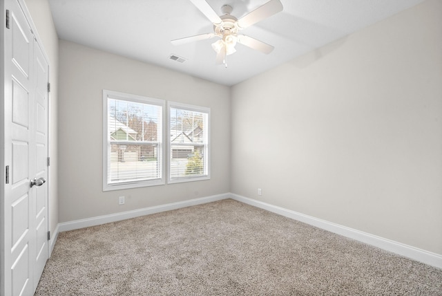 carpeted empty room with ceiling fan