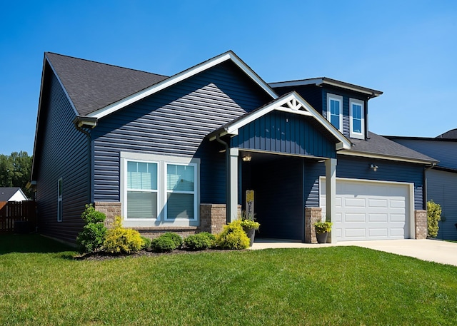 craftsman inspired home featuring a garage and a front yard