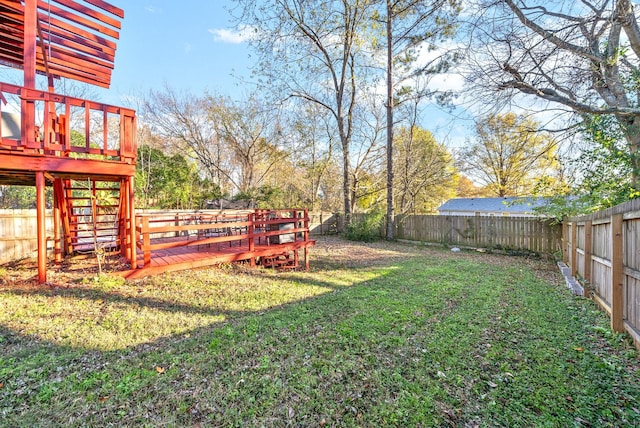 view of yard with a wooden deck