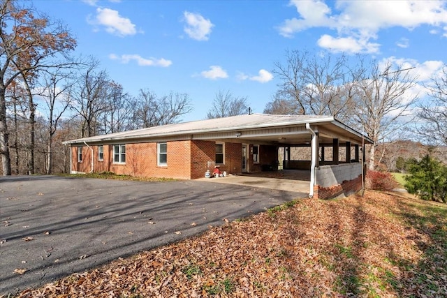 view of front of property with a carport