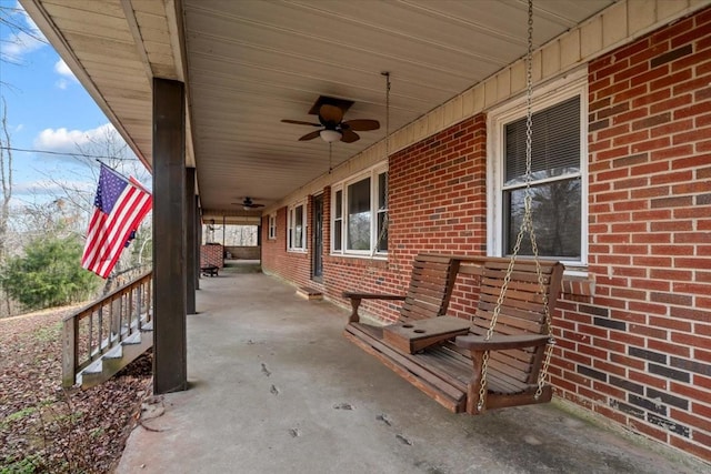 view of patio / terrace with ceiling fan and a porch