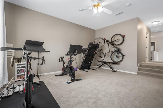 exercise area with carpet flooring and ceiling fan