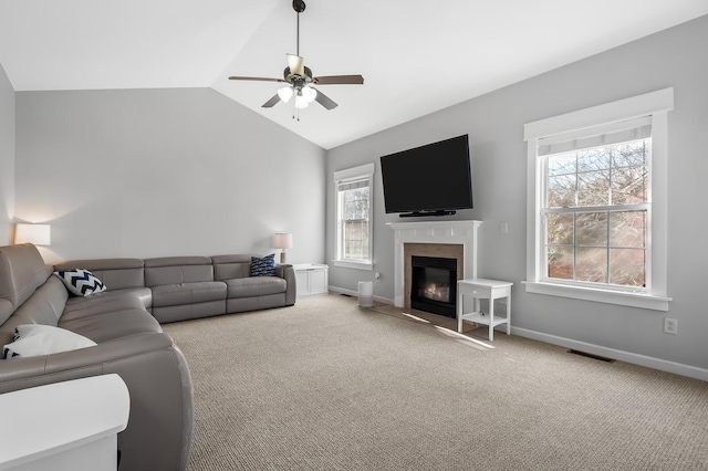 living room with light carpet, vaulted ceiling, and ceiling fan