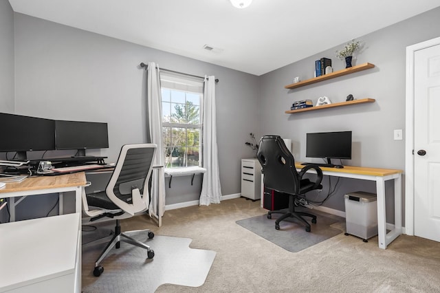 office area featuring light colored carpet