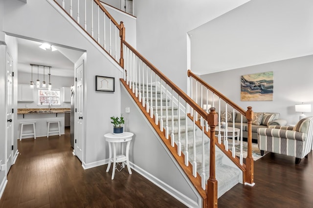 staircase with hardwood / wood-style flooring