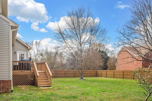 view of yard featuring a wooden deck