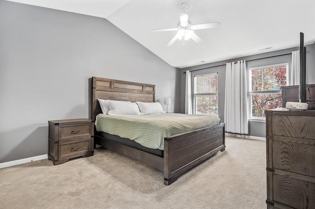 bedroom with ceiling fan, light colored carpet, and lofted ceiling