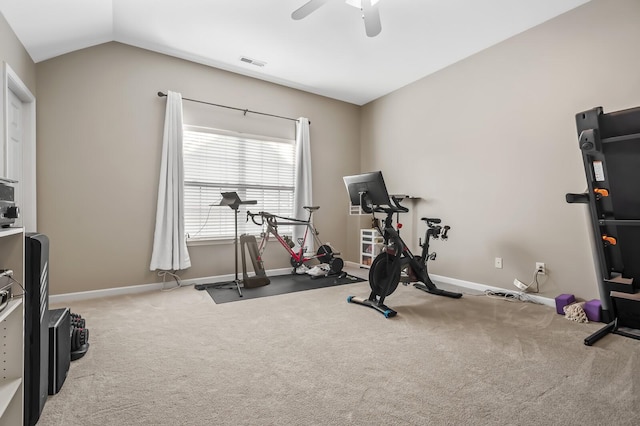 workout room with carpet flooring, ceiling fan, and vaulted ceiling