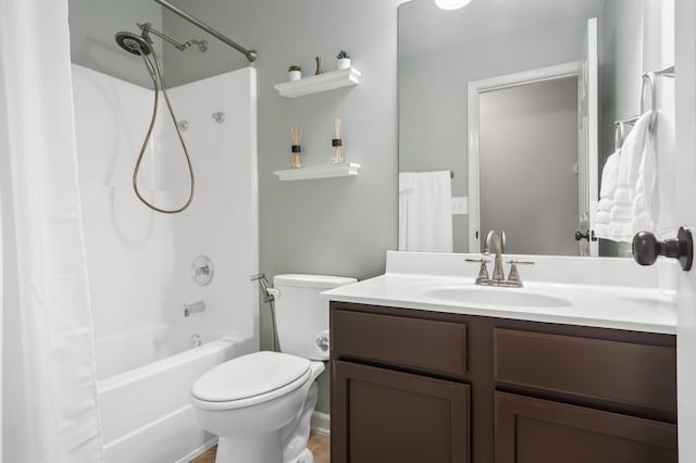 full bathroom with vanity, toilet, and shower / bath combo with shower curtain