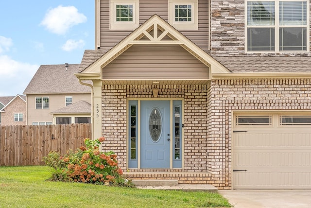 doorway to property with a garage