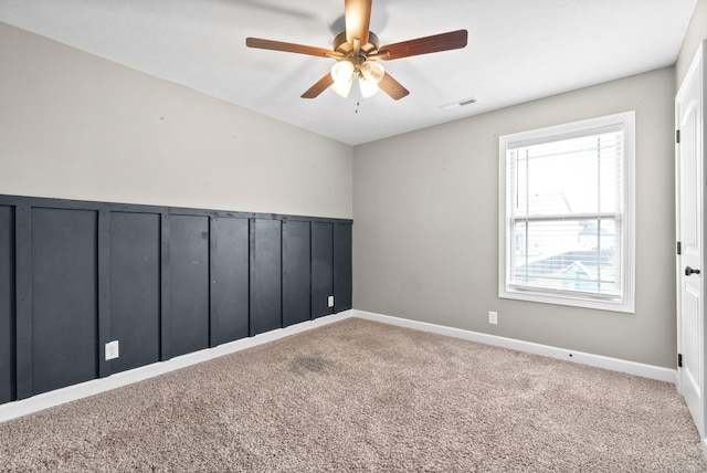 carpeted empty room with ceiling fan