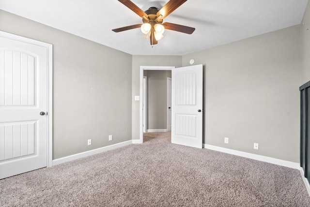 unfurnished bedroom featuring ceiling fan and carpet floors