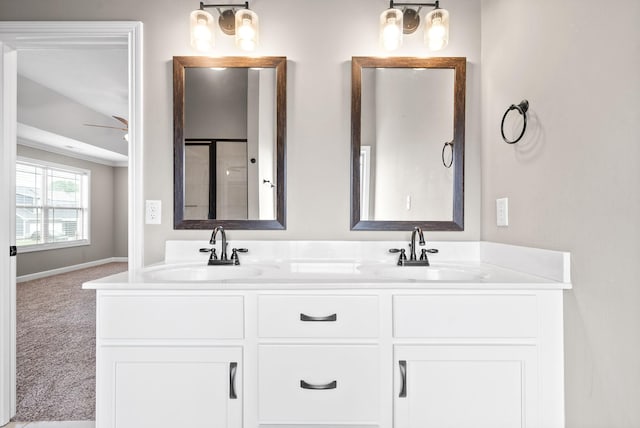 bathroom featuring ceiling fan and vanity