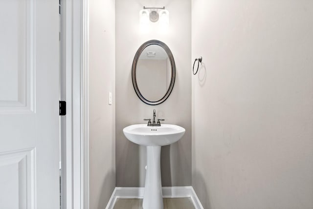 bathroom with tile patterned floors