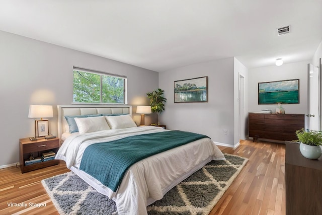 bedroom with light hardwood / wood-style floors