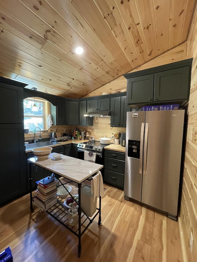 kitchen with wooden ceiling, light hardwood / wood-style flooring, appliances with stainless steel finishes, and vaulted ceiling