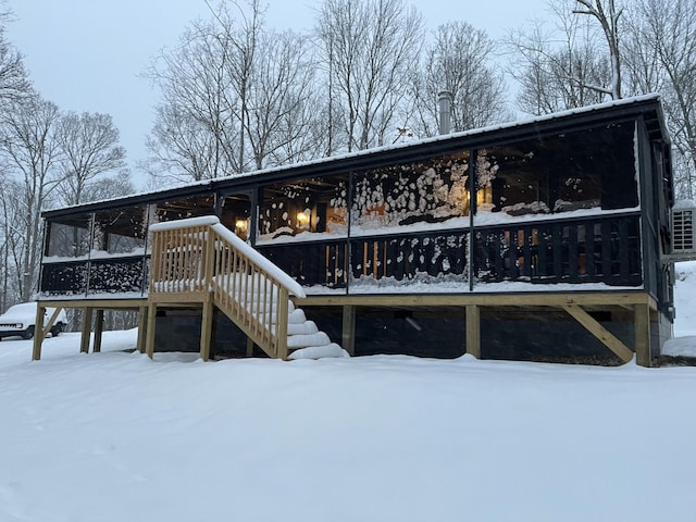 view of snow covered house