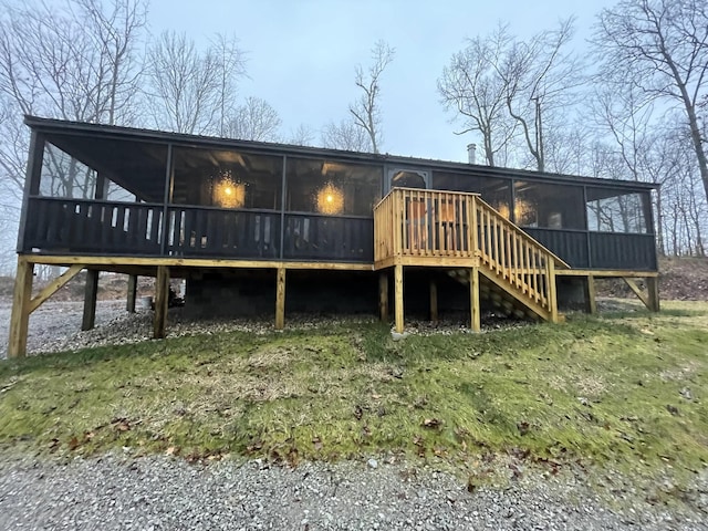 rear view of house with a sunroom