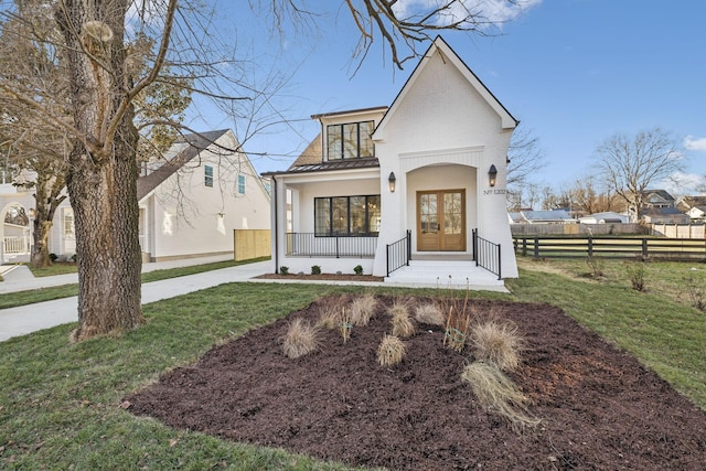 view of front facade featuring a front yard and a porch