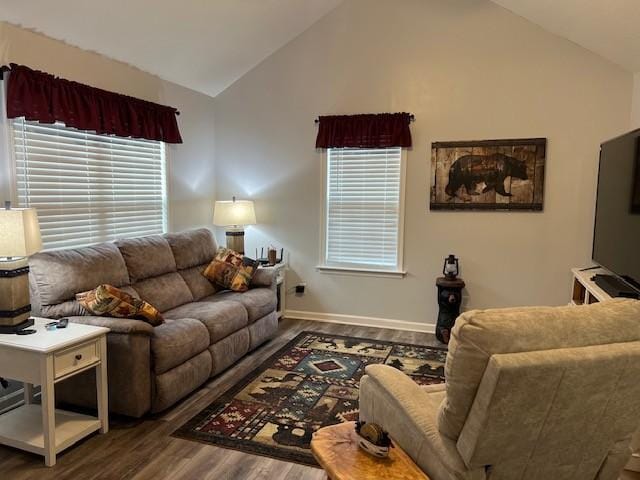 living room featuring dark hardwood / wood-style floors and lofted ceiling