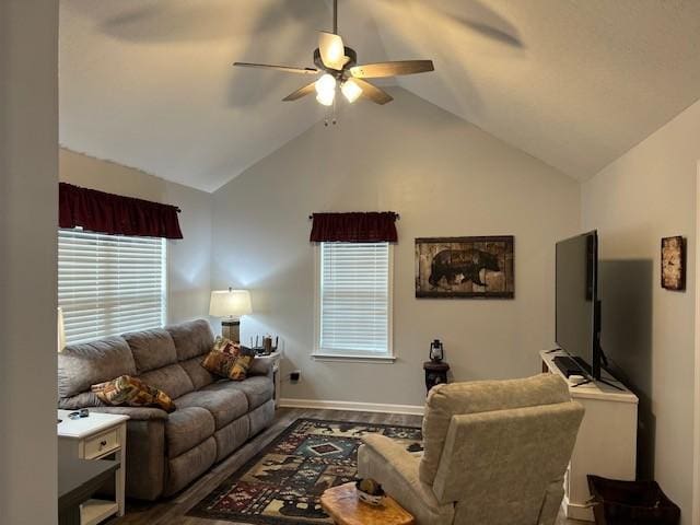 living room with hardwood / wood-style floors, ceiling fan, and high vaulted ceiling