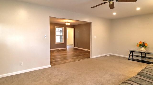 unfurnished living room with carpet flooring and ceiling fan