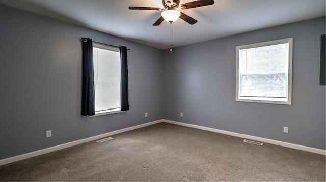 unfurnished room featuring carpet flooring and ceiling fan