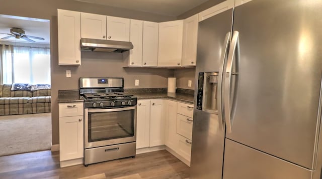 kitchen with white cabinetry, hardwood / wood-style floors, ceiling fan, and stainless steel appliances