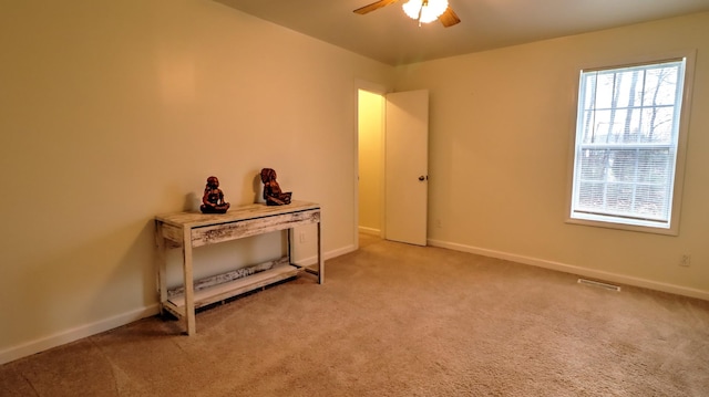 interior space featuring ceiling fan