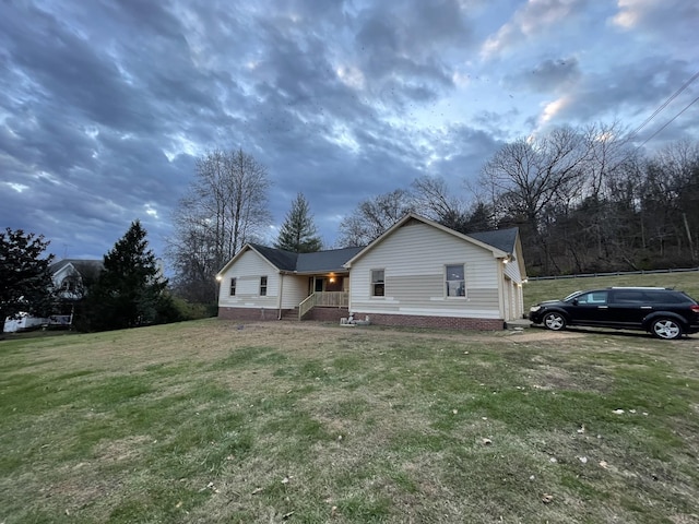 view of property exterior with a lawn