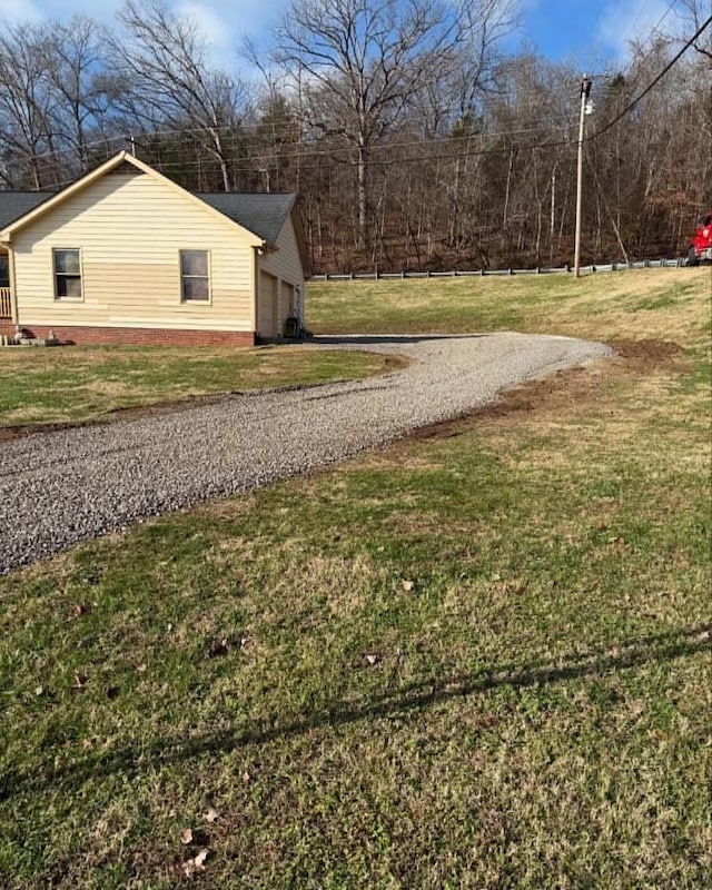 view of home's exterior with a yard