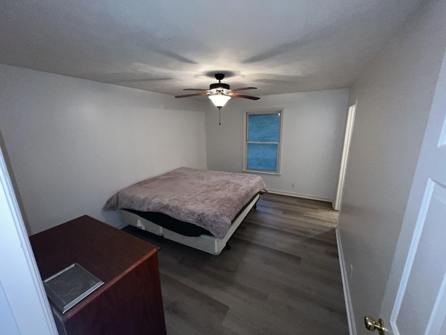 bedroom featuring ceiling fan and dark hardwood / wood-style floors