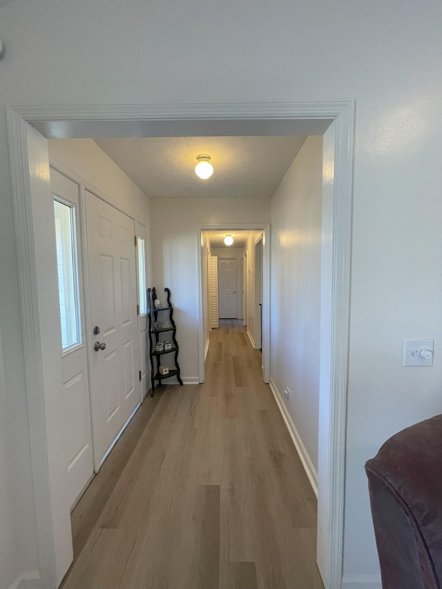 hall featuring light wood-type flooring