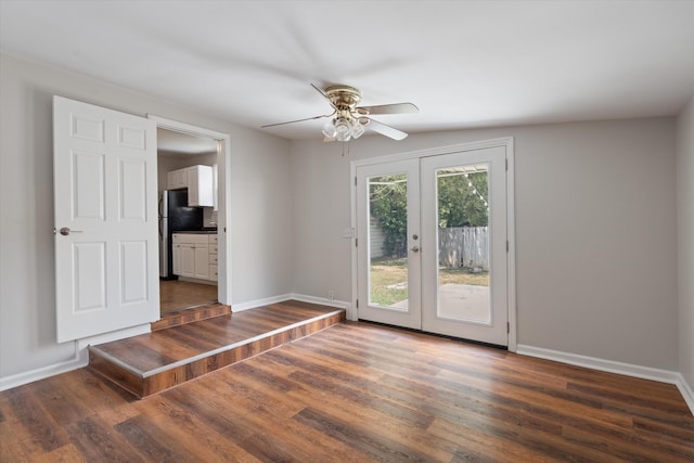 doorway with vaulted ceiling, ceiling fan, french doors, and dark hardwood / wood-style floors