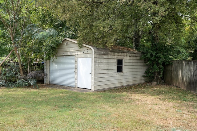 view of outbuilding featuring a yard