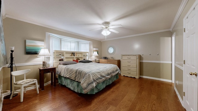 bedroom with ceiling fan, dark hardwood / wood-style floors, and ornamental molding