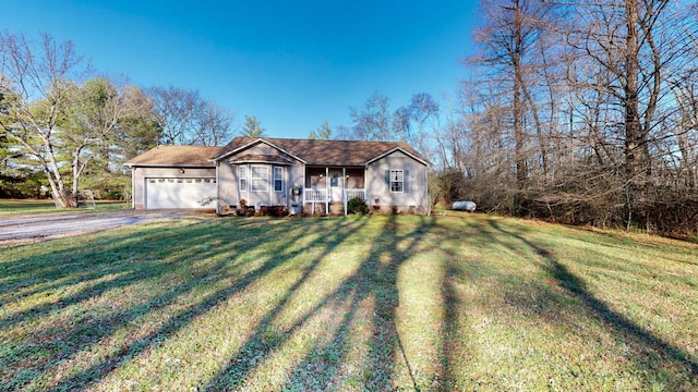 single story home featuring a porch, a garage, and a front lawn