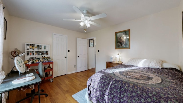 bedroom with ceiling fan and light hardwood / wood-style floors