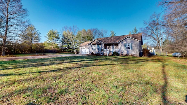 ranch-style house with covered porch and a front lawn