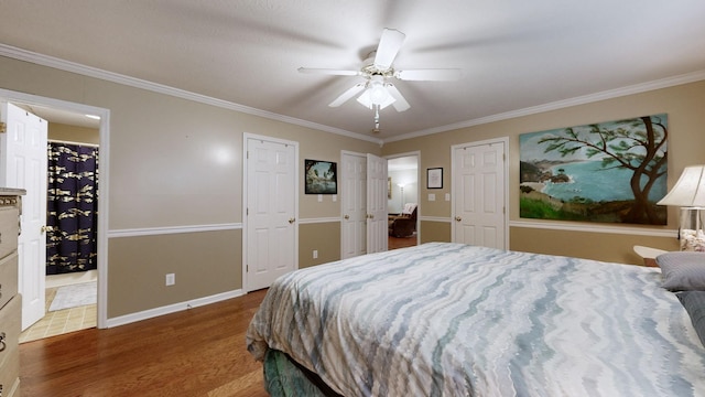 bedroom with ceiling fan, dark hardwood / wood-style floors, and ornamental molding