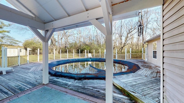 wooden deck featuring a covered pool