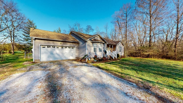 view of front facade featuring a garage and a front lawn