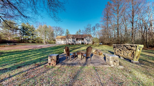 view of yard featuring a patio and a fire pit