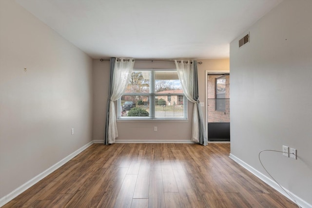 empty room featuring hardwood / wood-style flooring