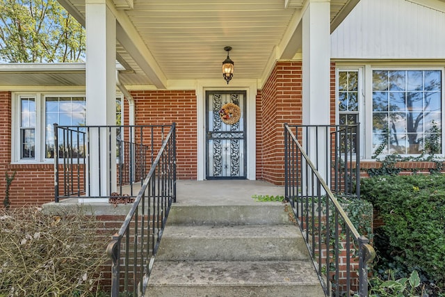 entrance to property featuring covered porch